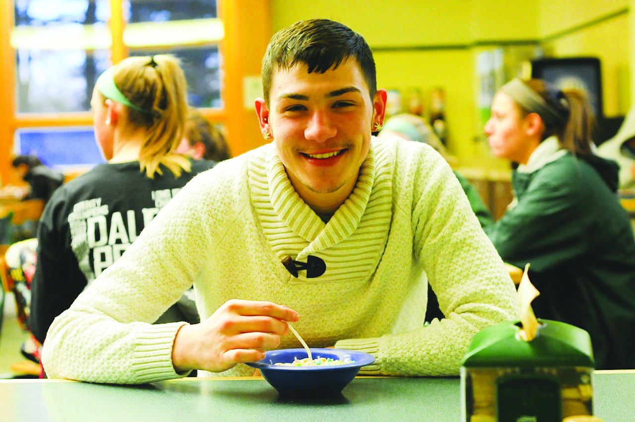 Cody Petit, a Musical Theatre major, enjoys a bowl of cereal in the Winnick Dining Hall. Photo: Tyler Tarae Hutchins